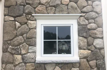 Groton, Mass - Stone veneer on face of house and columns with blue stone cap and tile.